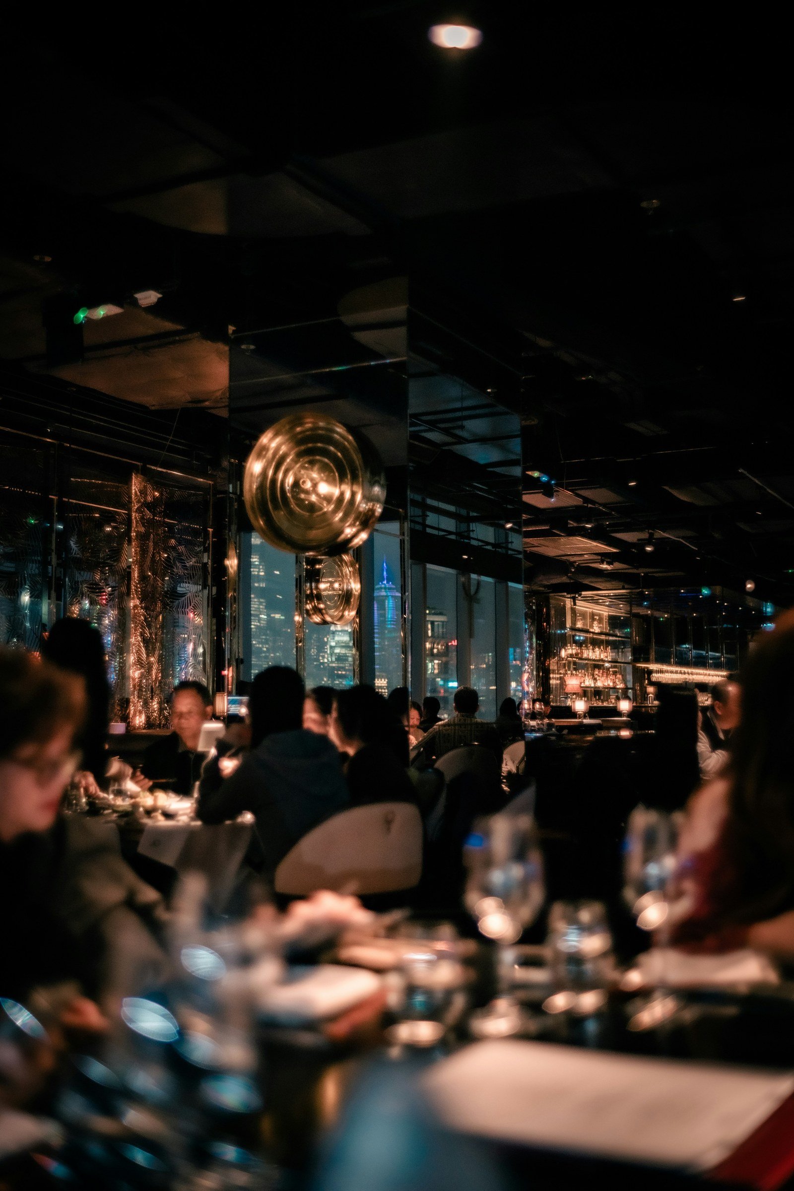 Events — a dining room over the city at night.